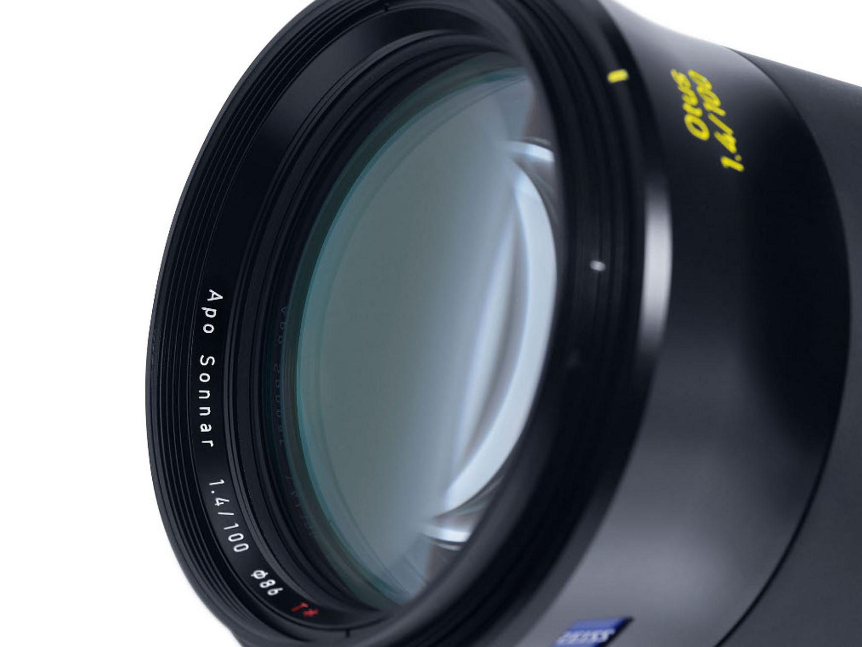 Close-up view of a ZEISS Apo Sonnar 135mm f/2 lens showcasing the front glass element and detailed lens markings.