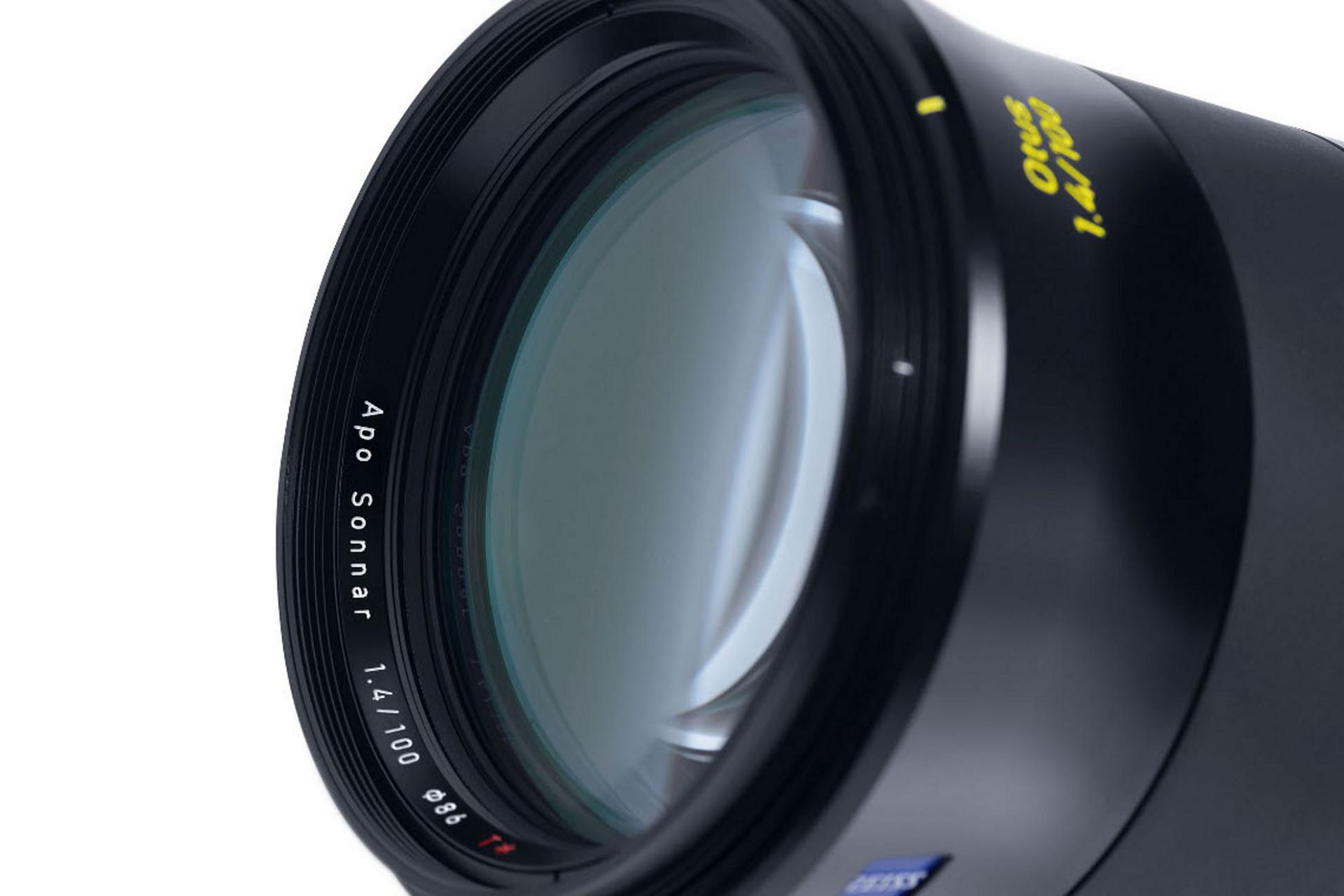 Close-up view of a ZEISS Apo Sonnar 135mm f/2 lens showcasing the front glass element and detailed lens markings.