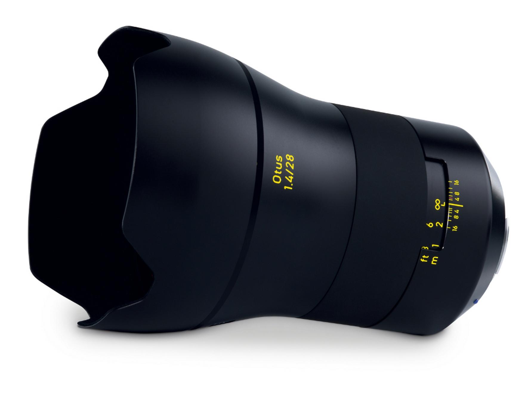 Black ZEISS Otus 1.4/28 camera lens with yellow focal length markings and petal-shaped lens hood.