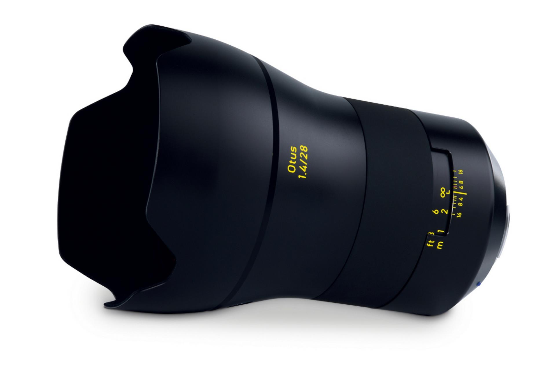Black ZEISS Otus 1.4/28 camera lens with yellow focal length markings and petal-shaped lens hood.