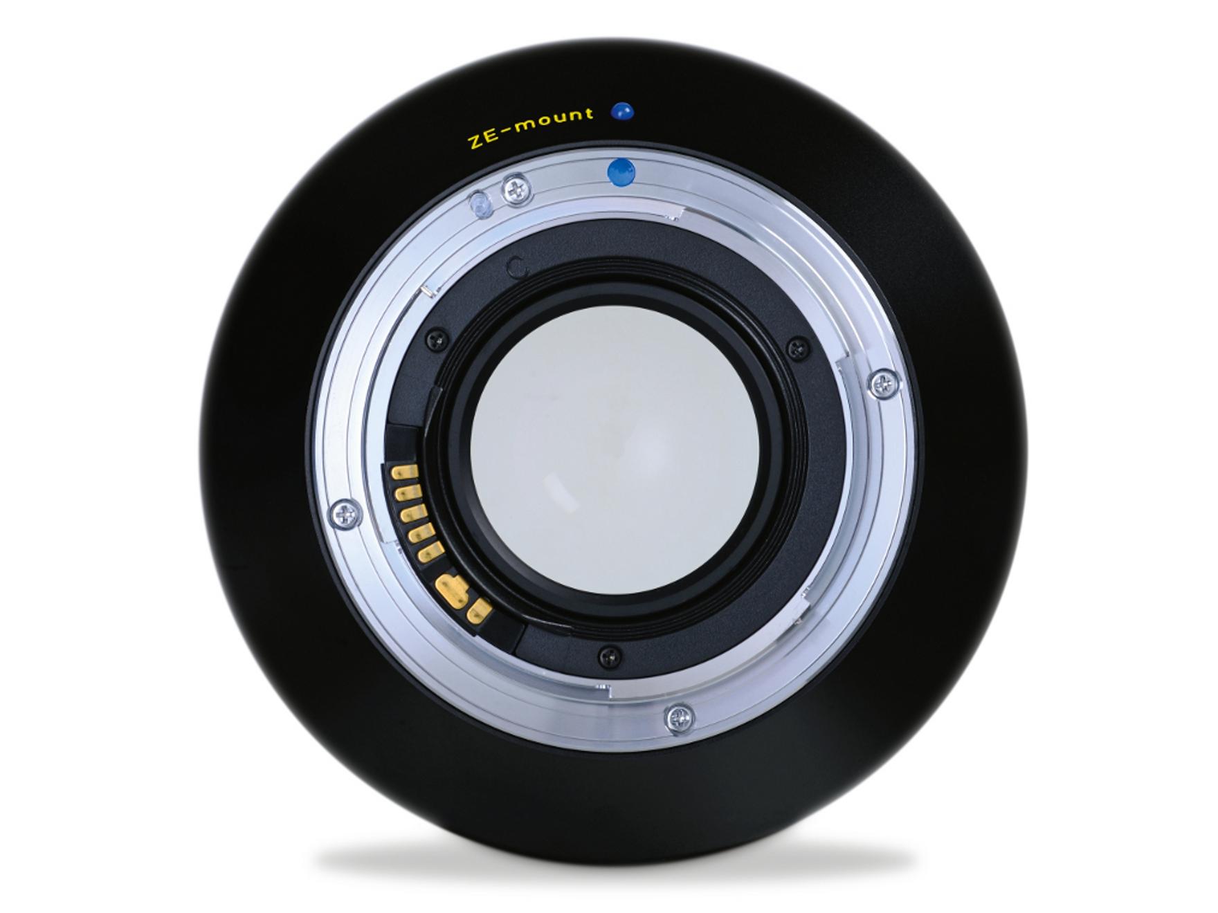 Rear view of a ZEISS camera lens with visible electronic contacts and ZF.2 mount labeling.