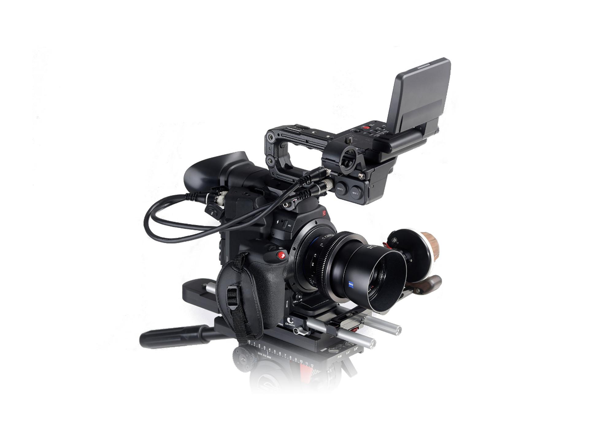 Professional video camera setup equipped with a ZEISS lens and mounted on a rig with an external monitor.