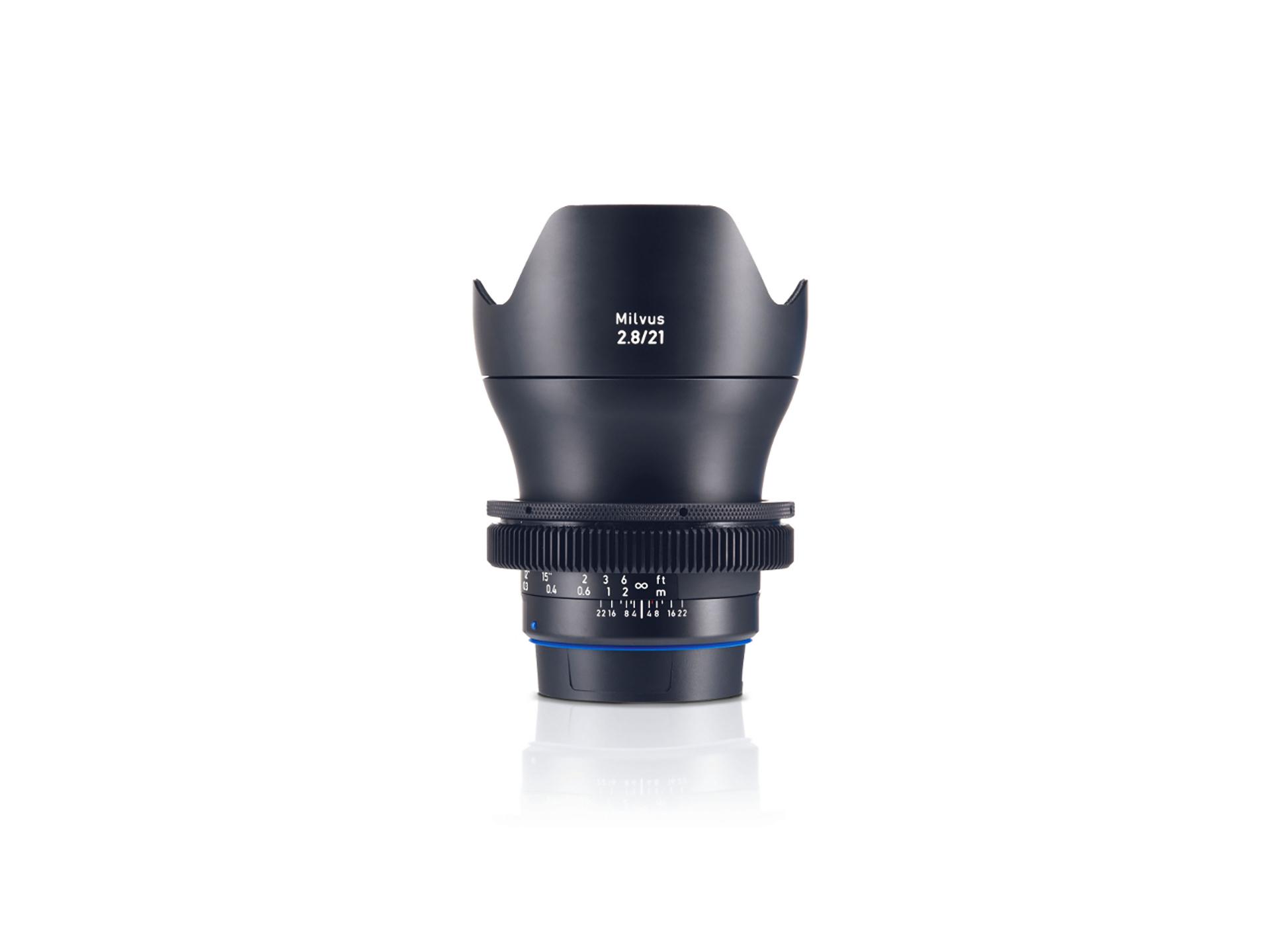 Front view of a ZEISS Milvus 2.8/21 camera lens with focus and aperture rings visible.