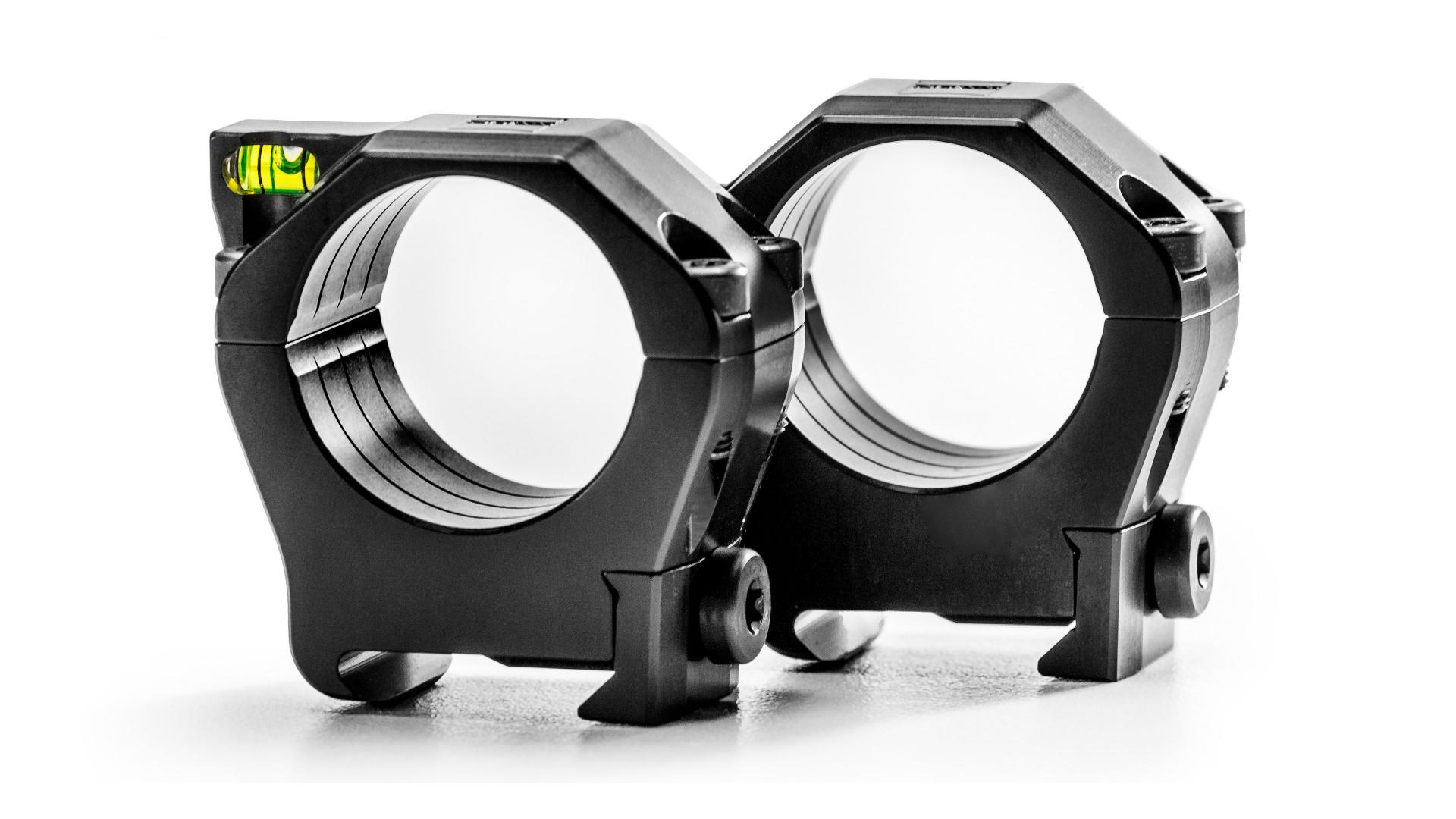 Two black ZEISS precision scope mounting rings with integrated bubble level displayed on a white background.