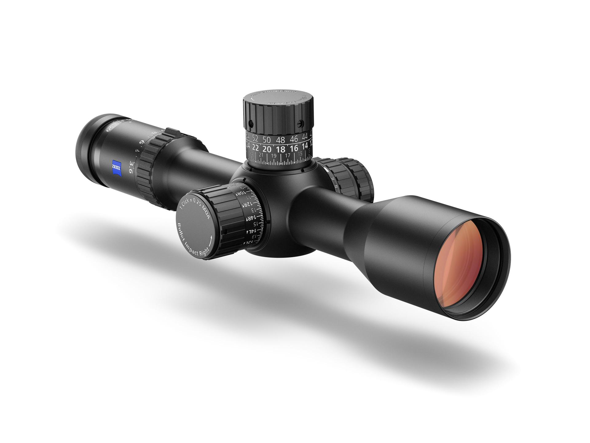 Black ZEISS riflescope with multiple adjustment dials and a red-tinted objective lens shown on a white background.