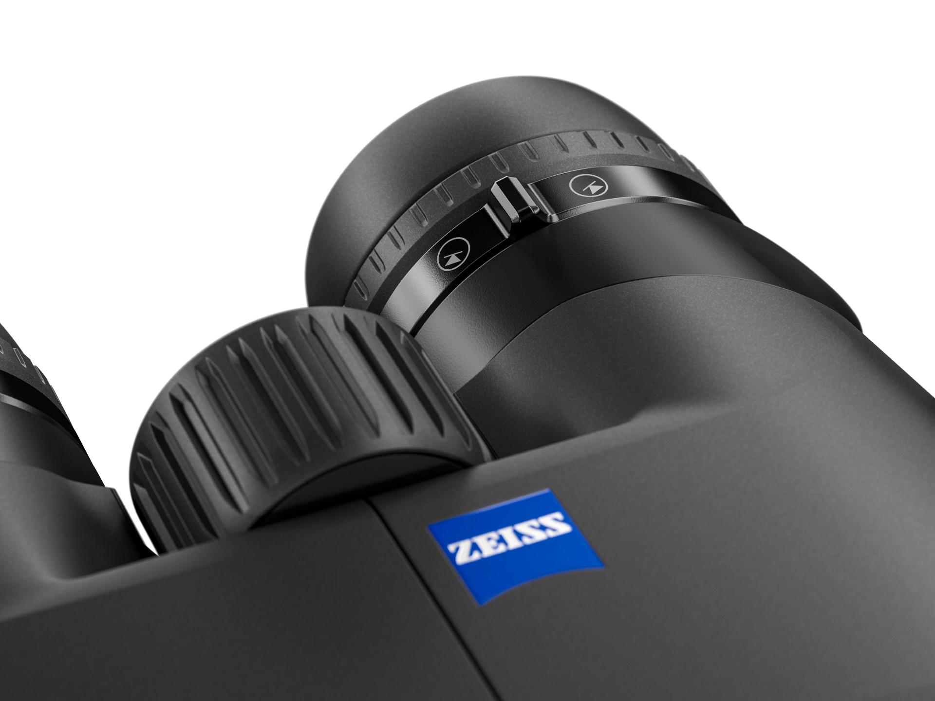 Close-up view of the eyepiece and focus adjustment knob on a pair of black ZEISS binoculars with the ZEISS logo visible.