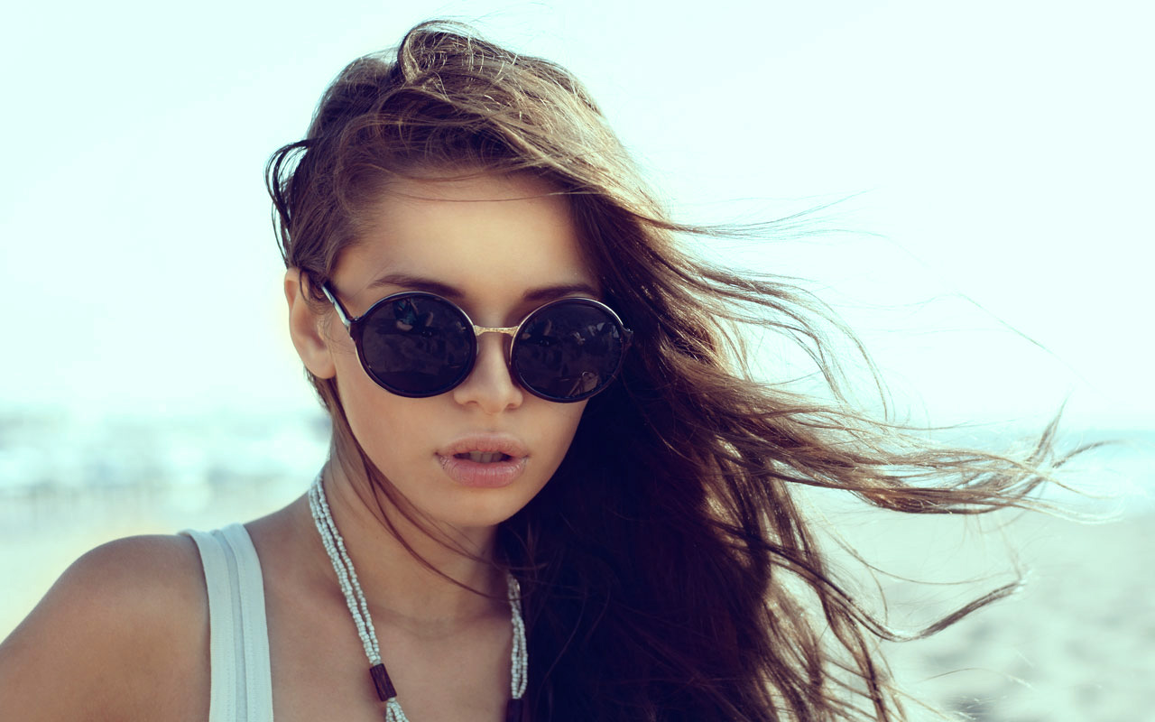 girl in sunglasses at beach