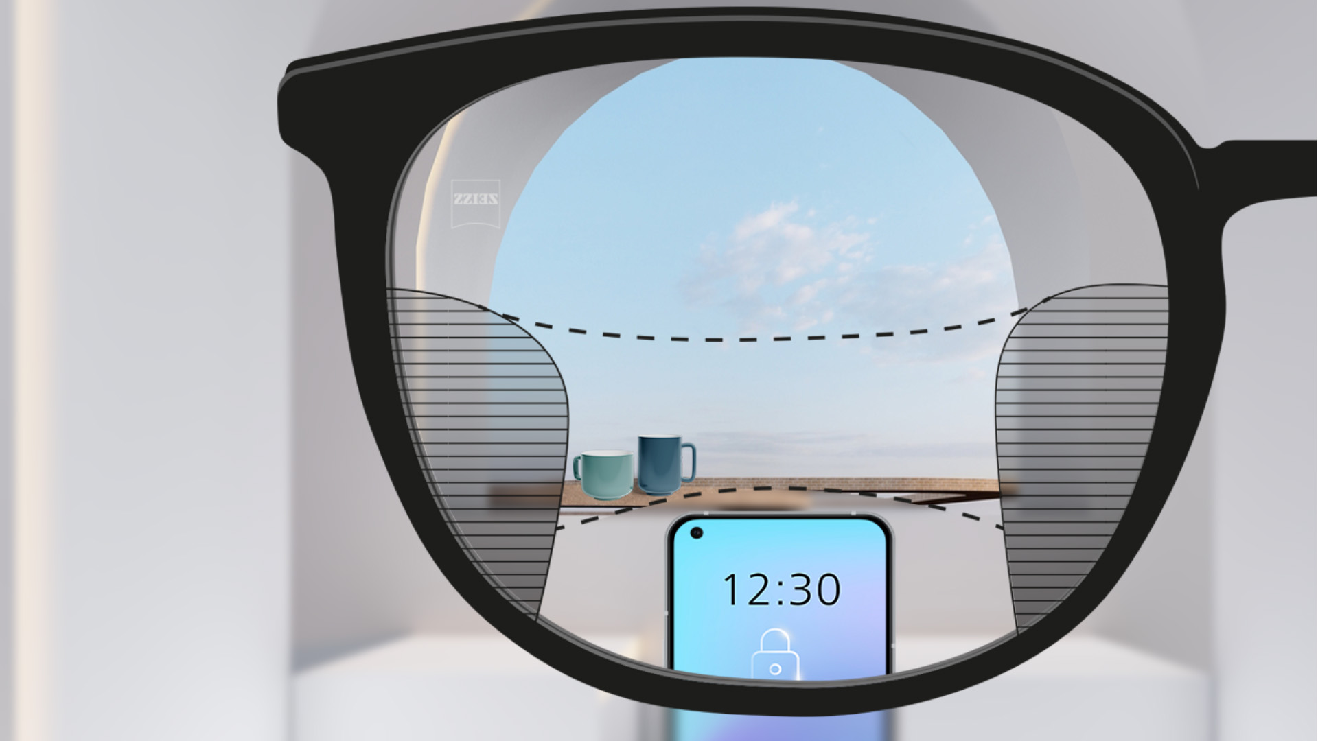 A point of view image with ZEISS Progressive SmartLife lenses with a smartphone and cups in the background while the lens is fully clear with slim blurry plots left and right.