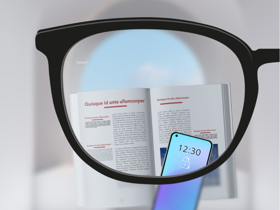A point of view image with ZEISS Single Vision SmartLife lenses with a smartphone and book and the lens being fully clear.